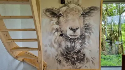 a painting of a sheep on a wall at City Farmers Lodge, a Guesthouse with a skyline view in Rural Amsterdam in Amsterdam