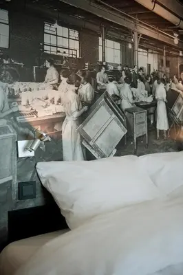 an old photo of a group of people in a factory at Inntel Hotels Amsterdam Zaandam in Zaandam