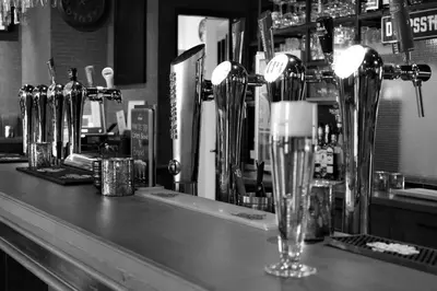 a bar with a counter top with glasses on it at Het Wapen van Harmelen in Harmelen