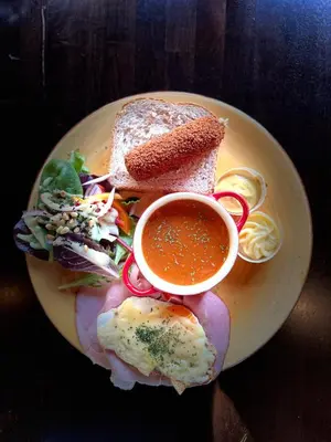 a plate of food with a sandwich and a bowl of soup at Het Wapen van Harmelen in Harmelen