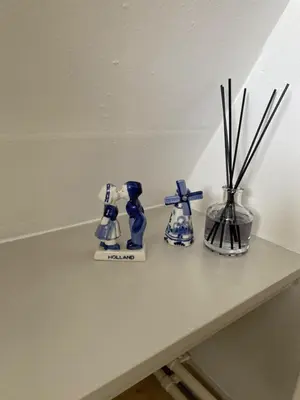 three blue and white vases sitting on a table at Het Popelhuisje in Alkmaar