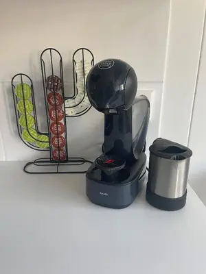 a black coffee maker sitting on a counter next to at Zee En Meer in Egmond aan Zee