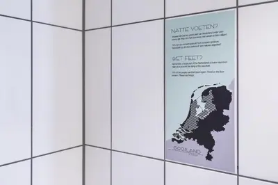 a sign on a wall with a map of australia at Gooiland Hotel in Hilversum