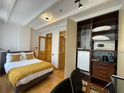 a hotel room with a bed and a refrigerator at Amsterdam-bnb in Amsterdam
