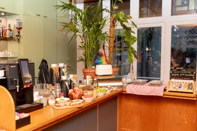 a counter in a restaurant with food on it at Hotel La Bohème in Amsterdam