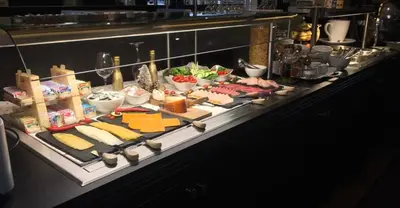 a buffet line with different types of food on display at Boutique Hotel Chariot - Amsterdam Schiphol Airport in Aalsmeer