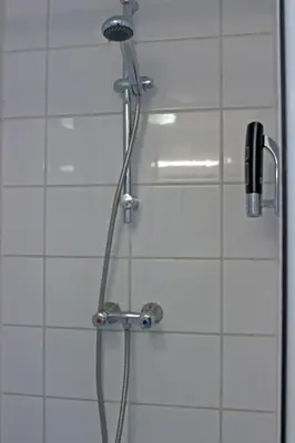 a shower in a bathroom with a shower head at Koopermoolen in Amsterdam