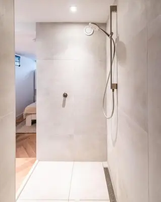a shower with a glass door in a bathroom at Beautiful Amstel houseboat in Amsterdam