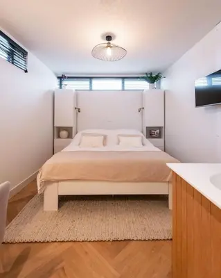 a bedroom with a large bed in a room at Beautiful Amstel houseboat in Amsterdam