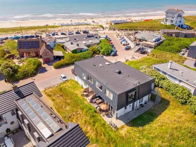 an aerial view of a building next to the beach at Beach house Alba in Bergen aan Zee