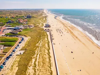 an aerial view of a beach and the ocean at Beach house Alba in Bergen aan Zee