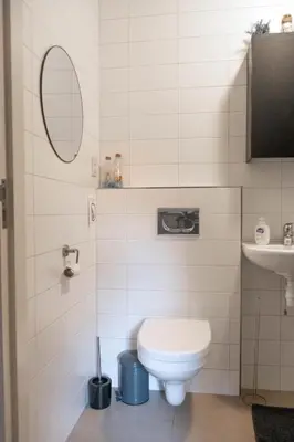 a bathroom with a toilet and a sink at 'T Heilige Pad in Egmond aan Zee