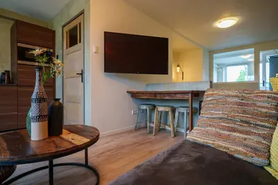 a living room with a couch and a table at City Design Studio in Alkmaar