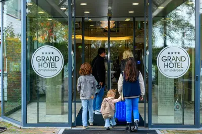 a group of people walking out of a grand hotel at Grand Hotel Amstelveen in Amstelveen