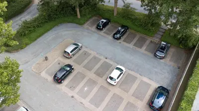a group of cars parked in a parking lot at Grand Hotel Amstelveen in Amstelveen