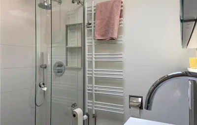 a bathroom with a shower with a glass door at Stunning Home In Noordwijk With Wifi in Noordwijk aan Zee
