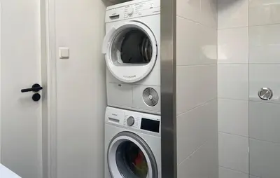 a washing machine and a dryer in a bathroom at Stunning Home In Noordwijk With Wifi in Noordwijk aan Zee