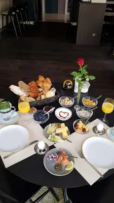 a table with a bunch of food on it at Hotel Lion D'Or in Haarlem