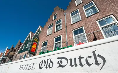 a hotel us district sign in front of a building at Hotel Old Dutch in Volendam