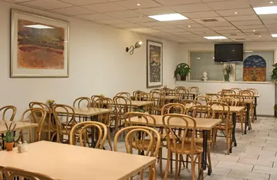 an empty dining room with tables and chairs at De Mallemoolen in Amsterdam