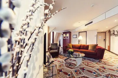 a living room with a couch and a table at Banks Mansion - Boutique Hotel in Amsterdam