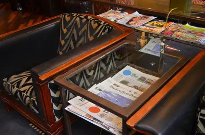 a chair sitting next to a counter with a table at Banks Mansion - Boutique Hotel in Amsterdam