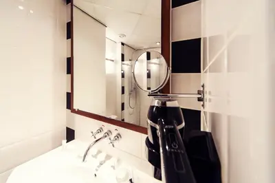 a bathroom with a coffee maker on a sink at Banks Mansion - Boutique Hotel in Amsterdam