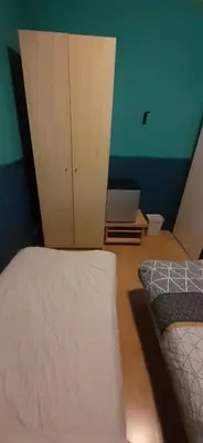 a bedroom with a bed and a cabinet in it at CHARLOTTE, not for parties, not a hotel, room with shared bathroom, no kitchen in Amsterdam