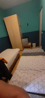 a room with two beds in a room with a wall at CHARLOTTE, not for parties, not a hotel, room with shared bathroom, no kitchen in Amsterdam