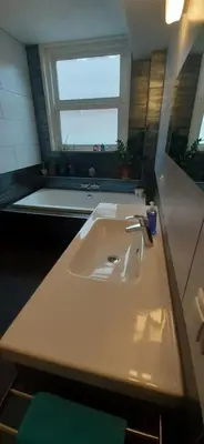 a white sink in a bathroom with a window at CHARLOTTE, not for parties, not a hotel, room with shared bathroom, no kitchen in Amsterdam