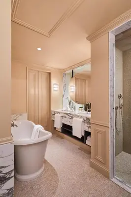 a large bathroom with a tub and a sink at De L’Europe Amsterdam – The Leading Hotels of the World in Amsterdam