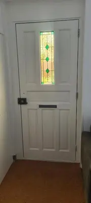 a door with a stained glass window on it at The Flower Fields in Lisse