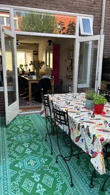 a table and chairs sitting on a patio at BeBaBops Homestay Utrecht in Utrecht