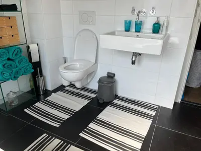 a bathroom with a toilet and a sink at BeBaBops Homestay Utrecht in Utrecht