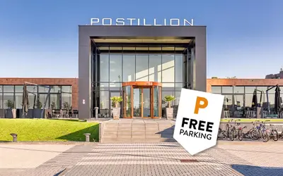 a free parking sign in front of a building at Postillion Utrecht Bunnik in Bunnik