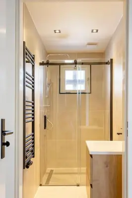 a bathroom with a shower and a sink at SéSé in Vinkeveen