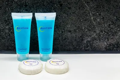 two bottles of disinfection products sitting on a table at Bastion Hotel Almere in Almere