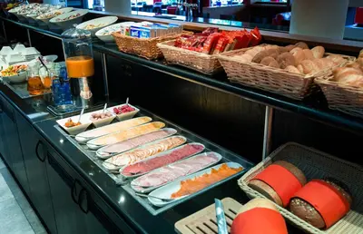 a buffet line with many different types of food at Best Western Plus Amsterdam Airport Hotel in Hoofddorp
