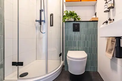 a bathroom with a toilet and a shower at Boutique Studio Amsterdam near RAI and De Pijp in Amsterdam