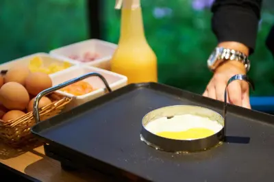 a tray of food with eggs on a table at Bastion Hotel Leiden Voorschoten in Leiden