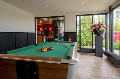 a billiard room with a pool table at Bastion Hotel Schiphol Hoofddorp in Hoofddorp
