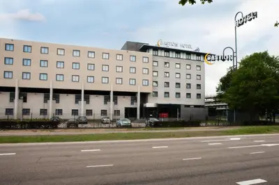 a large building with a street in front of it at Bastion Hotel Utrecht in Utrecht