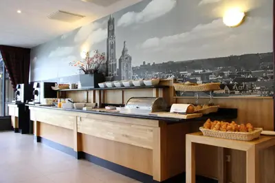 a restaurant counter with a view of a city at Bastion Hotel Utrecht in Utrecht