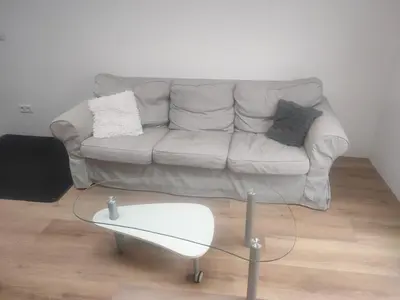 a living room with a couch and a coffee table at House with garden in the center close to the sea and Amsterdam in Beverwijk
