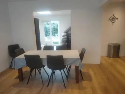 a dining room with a table and chairs at House with garden in the center close to the sea and Amsterdam in Beverwijk