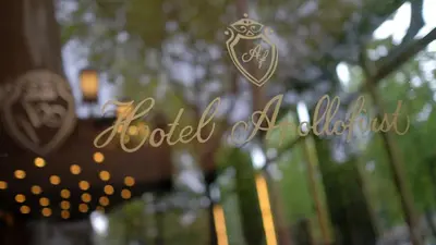 a sign with the words rocket ash in front of trees at Apollofirst Boutique Hotel in Amsterdam