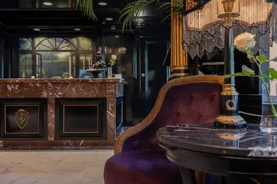 a dining room with a table and a chair at Apollofirst Boutique Hotel in Amsterdam