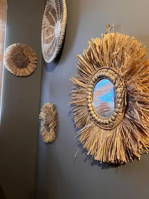 a wall with three different types of wreaths on it at Casa Xabia in Zaandam