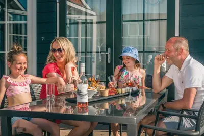 a group of people sitting at a table at De Beemster | Holiday park near Amsterdam in De Rijp