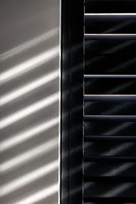 a close up of a metal door with blinds at Lovely private cottage near Amsterdam in Broek in Waterland
